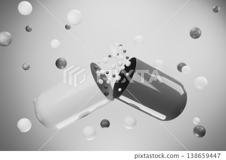 Black and white medicine capsule breaking into particles 138659447
