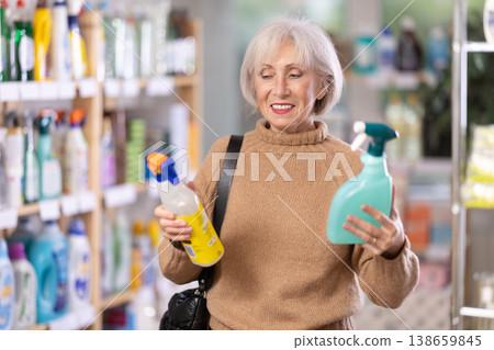 Elderly woman choosing spray in store Elderly woman choosing spray in store 138659845