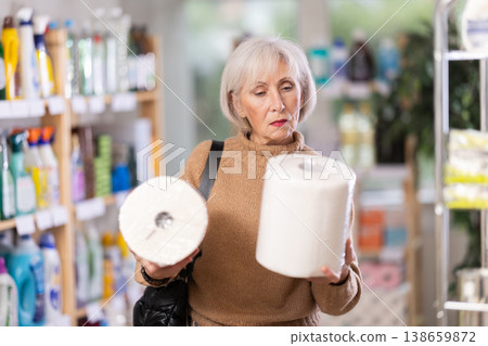 customer chooses large paper towels 138659872
