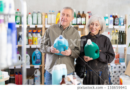 Elderly couple choosing cleaning product in supermarket Elderly couple choosing cleaning product in supermarket 138659941