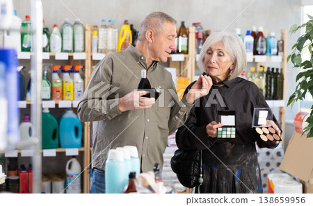 Husband and wife choose cosmetics and perfume together in supermarket Husband and wife choose cosmetics and perfume together in supermarket 138659956