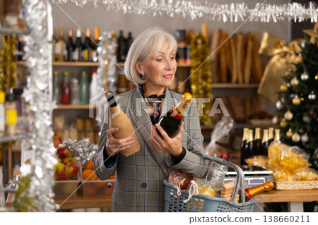 Elderly woman choosing wine in grocery store 138660211