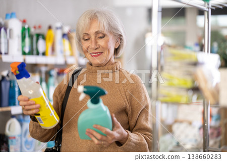 Elderly woman choosing spray in store Elderly woman choosing spray in store 138660283