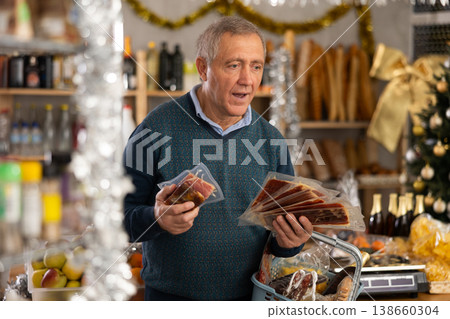 Elderly man choosing jamon in grocery store Elderly man choosing jamon in grocery store 138660304