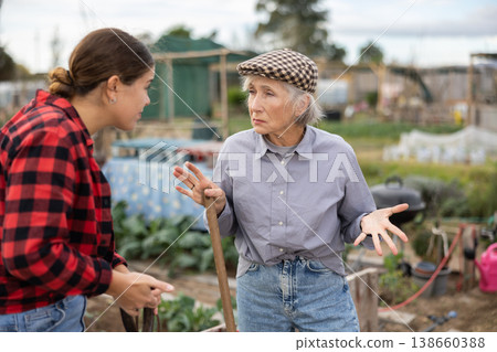 Conflict between female neighbors in country farm Conflict between female neighbors in country farm 138660388