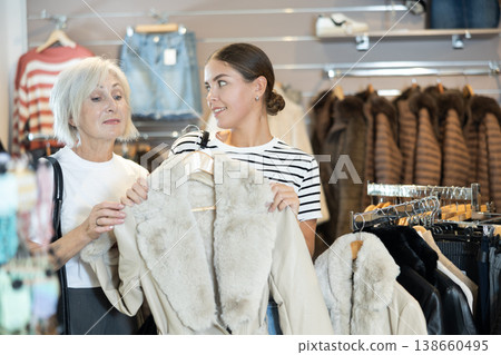 Shoppers take their time examining Shoppers take their time examining 138660495