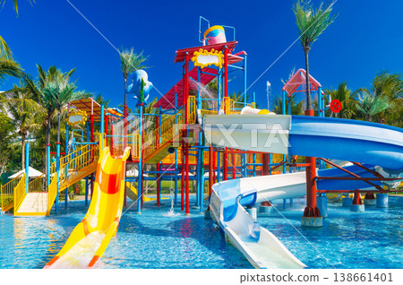 kids water park in the pool at resort on summer vacation. Colorful aquapark with slides for children in pool kids water park in the pool at resort on summer vacation. Colorful aquapark with slides for children in pool 138661401