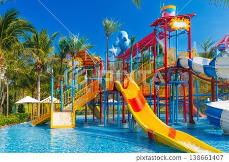children's water park in pool at the resort on summer vacation. Colorful aquapark with slides for kids in the pool children's water park in pool at the resort on summer vacation. Colorful aquapark with slides for kids in the pool 138661407