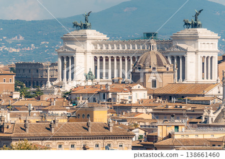 Rome cityscape with historic buildings and domes under a clear sky. Altare della Patria 138661460