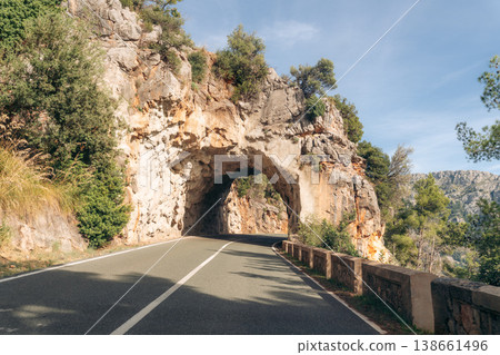 Majorca mountain road with a unique rock tunnel for scenic drives and exploration 138661496