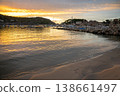Golden sunset illuminates Port de Soller Majorca harbor, boats, and coastal town 138661497