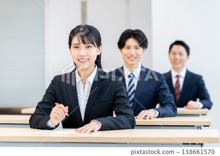 Businesswomen attending a seminar. Photo courtesy of Denpa Gakuen Educational Foundation, Tokyo Electronics College. 138661570
