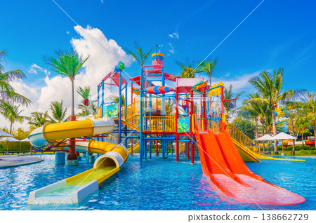 big children's water park in pool at the resort on summer vacation. Aquapark with slides for kids in the pool big children's water park in pool at the resort on summer vacation. Aquapark with slides for kids in the pool 138662729