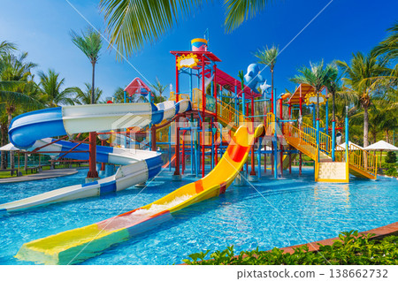 children's water park in the pool at resort on summer vacation. Colorful aquapark with slides for children in the pool children's water park in the pool at resort on summer vacation. Colorful aquapark with slides for children in the pool 138662732