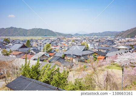 A view of Izushi town from the ruins of Izushi Castle, where the cherry blossoms are in full bloom, in Toyooka City, Hyogo Prefecture. A view of Izushi town from the ruins of Izushi Castle, where the cherry blossoms are in full bloom, in Toyooka City, Hyogo Prefecture. 138663161