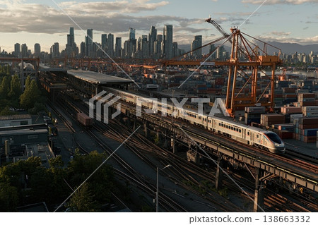 Wide Angle Shot of Cargo Train Departing with City Skyline in Background 138663332