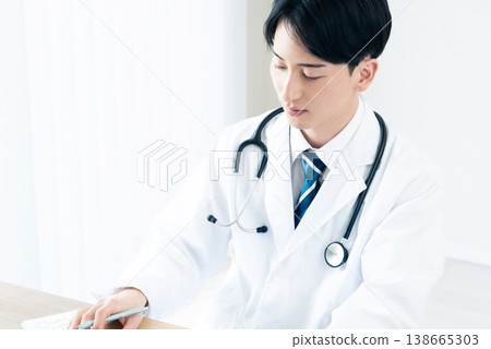 A young doctor conducting a medical interview A young doctor conducting a medical interview 138665303