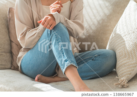 Stylish housewife Asian woman relaxing on the sofa in the living room 138665967