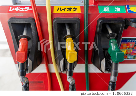 Color-coded fuel nozzles at gas stations 138666322