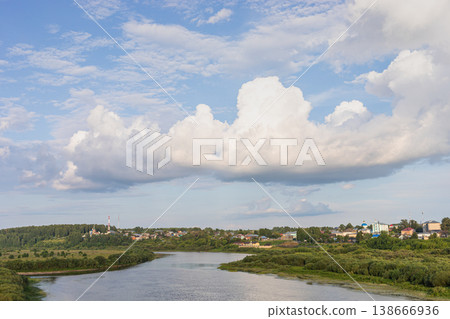 Scenic river landscape with majestic clouds in sky in Sovetsk, Kirov region, Russia 138666936