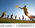 Male ultimate frisbee player throwing disc at sunset 138668053