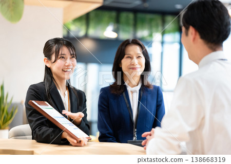 A woman explaining the contract details. 138668319