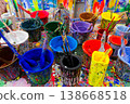 Colorful Paint Cans and Brushes on Splattered Studio Table Puppet Theater 138668518