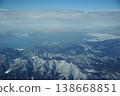 Aerial landscape photographs capturing winter mountain and lake scenery. 138668851