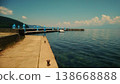 The clear blue water and the endless blue sky, enveloped in the gentle sound of waves, create a scene that feels like a release of the soul. 138668888