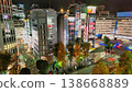The streets of Ikebukuro are illuminated by vibrant signs and streetlights. Looking down, the city corners are bustling with the energy of a city that never sleeps. 138668889