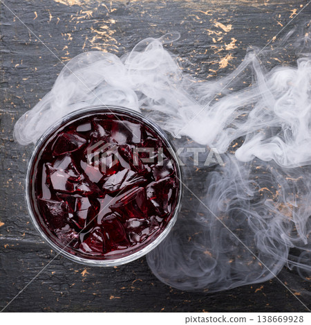 Red cocktail with ice and smoke Red cocktail with ice and smoke 138669928