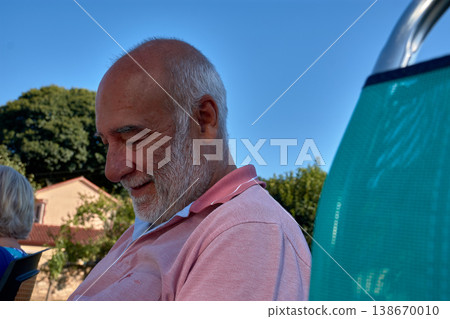 Close-up of a retired man with a white beard making playful facial expressions Close-up of a retired man with a white beard making playful facial expressions 138670010