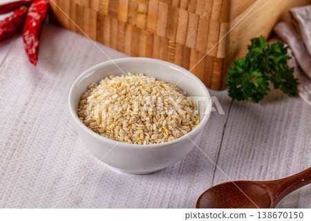 Raw dry sesame seeds heap 138670150