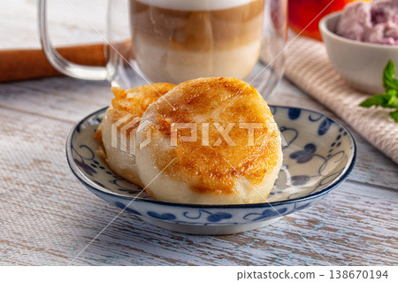 Fried homemade cottage cheese syrniki Fried homemade cottage cheese syrniki 138670194