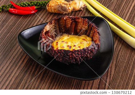 Baked sea urchin with cheese and egg 138670212