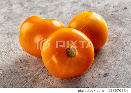 Ripe raw yellow tomato heap Ripe raw yellow tomato heap 138670284