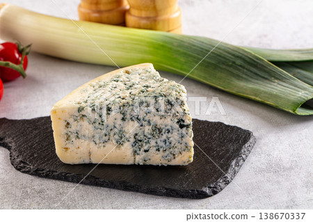 Blue cheese piece over board 138670337