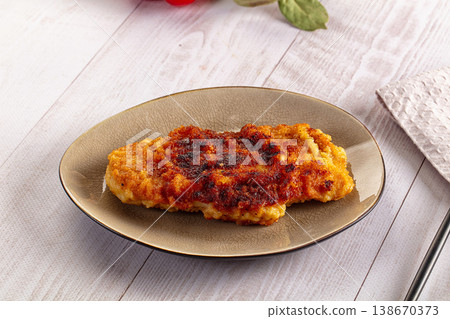 Roasted breaded crispy pork schnitzel Roasted breaded crispy pork schnitzel 138670373
