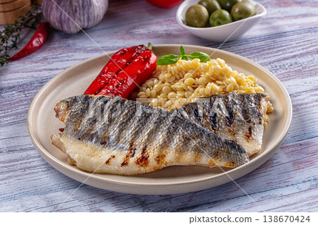 Grilled seabass fillet with ptitim 138670424