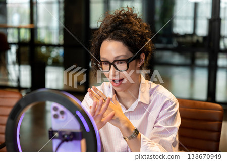 Female influencer explaining idea during live stream recording Female influencer explaining idea during live stream recording 138670949