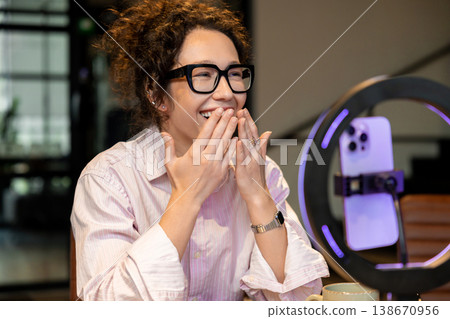 Woman host laughing while recording content for video blog 138670956