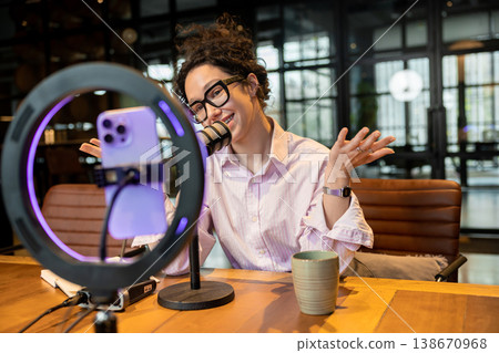 Woman host explaining idea during live video broadcast Woman host explaining idea during live video broadcast 138670968