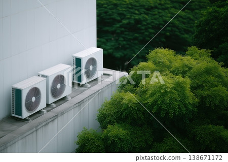 Air conditioning outdoor units on a modern building maintaining a cool inside temperature, representing hvac systems, technology, and sustainable energy solutions 138671172