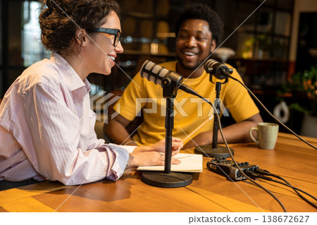 Woman smiling and talking to partner during interview 138672627