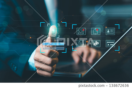 Businessman using fingerprint scanning for biometric login on virtual screen, cyber security and digital identity authentication technology. Businessman using fingerprint scanning for biometric login on virtual screen, cyber security and digital identity authentication technology. 138672636