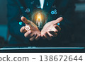 Businessman hands holding glowing rocket icon with business startup and growth symbols. Concept of project launch, innovation, and career success. 138672644