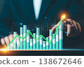 Businessman hand pointing at rising stock market growth chart with upward arrow. Financial investment, profit increase, and business success concept. 138672646