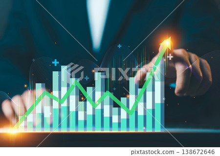 Businessman hand pointing at rising stock market growth chart with upward arrow. Financial investment, profit increase, and business success concept. 138672646