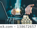 Businessman hand showing bank icon with global currency symbols and gold bars on table, central bank and international finance investment concept. 138672657