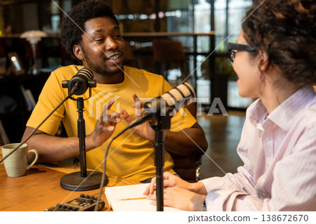 African man gesturing and explaining idea to partner African man gesturing and explaining idea to partner 138672670